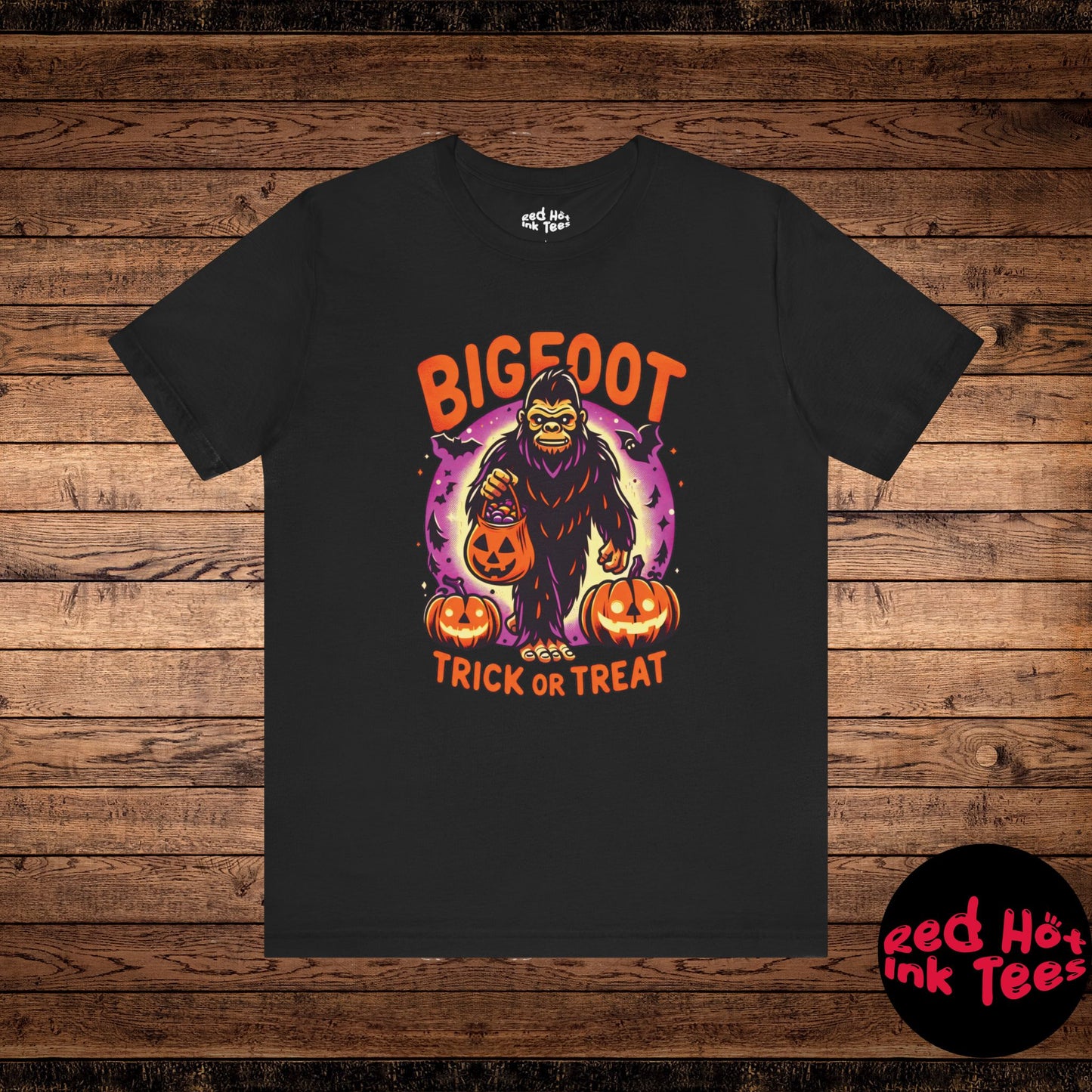 Fun Halloween design featuring Bigfoot holding a jack-o'-lantern candy bucket for trick or treating, surrounded by pumpkins and bats. Perfect for cryptid fans and Halloween enthusiasts who love spooky and playful designs.