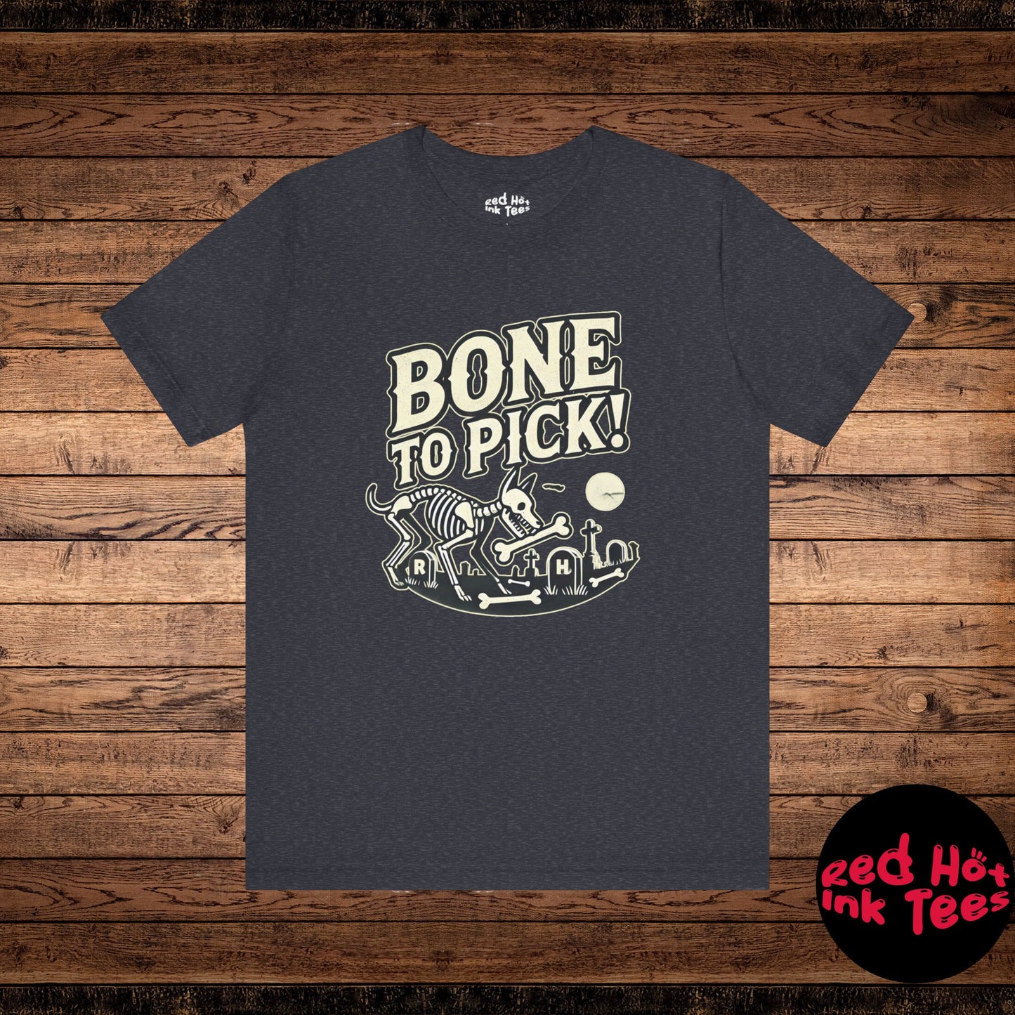 This spooky Halloween design features a skeleton dog in a graveyard with the phrase "Bone to Pick." Perfect for dog lovers and fans of skeleton or Gothic designs, this playful graphic is great for festive Halloween apparel or decor, adding a creepy yet fun touch to the season.